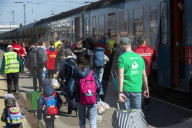 Hands of hope reach out to refugees with desperate tales of Kyiv escape