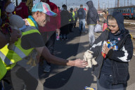 Hands of hope reach out to refugees with desperate tales of Kyiv escape