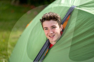 Devon’s ‘boy in the tent’ heads indoors after two-year camp out
Max Woosey, who raised more than £700k for his local hospice, will be spending less time under canvas – to his family’s relief