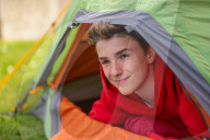 Devon’s ‘boy in the tent’ heads indoors after two-year camp out
Max Woosey, who raised more than £700k for his local hospice, will be spending less time under canvas – to his family’s relief