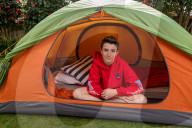 Devon’s ‘boy in the tent’ heads indoors after two-year camp out
Max Woosey, who raised more than £700k for his local hospice, will be spending less time under canvas – to his family’s relief