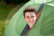Devon’s ‘boy in the tent’ heads indoors after two-year camp out
Max Woosey, who raised more than £700k for his local hospice, will be spending less time under canvas – to his family’s relief