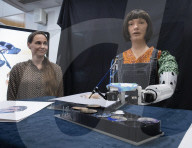 Ai-Da Robot painting at the British Library, Elliott Room, London,UK.
