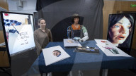 Ai-Da Robot painting at the British Library, Elliott Room, London,UK.
