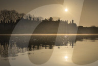 Sun rises over a misty River Thames