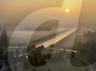 Sun rises over a misty River Thames
