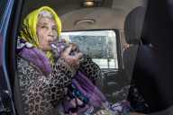 Red Cross volunteers distribute food and aid at Csengersimai on the Hungary Romania border.