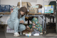 Red Cross volunteers distribute food and aid at Csengersimai on the Hungary Romania border.