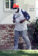 1980s TV icon Mr T is all covered up in an orange beanie and face mask as he shuffles around his LA neighborhood a few weeks before his 70th birthday.