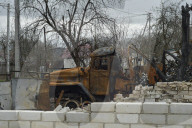 Charred houses, cratered lawns and an epic clean-up on road to Chernihiv