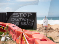 A 7m wall has gone up on a Sydney beach: are we destroying public space to save private property?