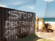 A 7m wall has gone up on a Sydney beach: are we destroying public space to save private property?