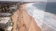 A 7m wall has gone up on a Sydney beach: are we destroying public space to save private property?