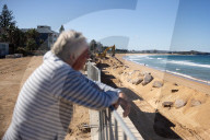 A 7m wall has gone up on a Sydney beach: are we destroying public space to save private property?