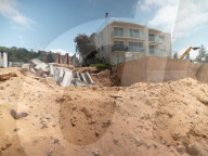 A 7m wall has gone up on a Sydney beach: are we destroying public space to save private property?