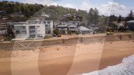 A 7m wall has gone up on a Sydney beach: are we destroying public space to save private property?