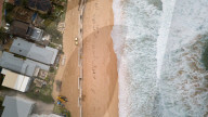 A 7m wall has gone up on a Sydney beach: are we destroying public space to save private property?