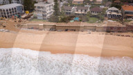 A 7m wall has gone up on a Sydney beach: are we destroying public space to save private property?