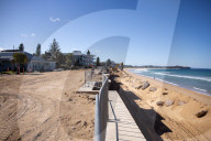 A 7m wall has gone up on a Sydney beach: are we destroying public space to save private property?