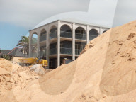 A 7m wall has gone up on a Sydney beach: are we destroying public space to save private property?