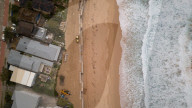 A 7m wall has gone up on a Sydney beach: are we destroying public space to save private property?