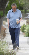 A cleaned-up Matthew Perry is seen in a rare public outing as he leaves a house in Los Angeles following a two-hour visit with friends. 
