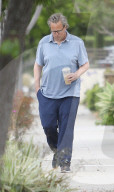 A cleaned-up Matthew Perry is seen in a rare public outing as he leaves a house in Los Angeles following a two-hour visit with friends. 