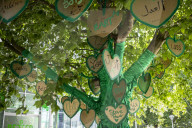 Grenfell Tower fire: fifth anniversary marked with silent march – in pictures
