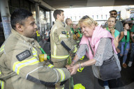 Grenfell Tower fire: fifth anniversary marked with silent march – in pictures