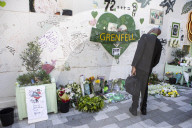 Grenfell Tower fire: fifth anniversary marked with silent march – in pictures