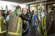 Grenfell Tower fire: fifth anniversary marked with silent march – in pictures