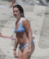 Bikini clad Ashley Tisdale enjoys a fun-filled day at the beach with husband Christopher French, their young daughter and a handful of friends on a scorching afternoon in Malibu. 