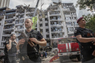 Russian missiles struck a residential building and the compound of a kindergarten in central Kyiv
