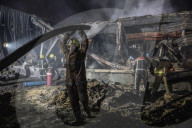 Aftermath of shopping centre attack in Ukraine - in pictures