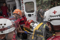 Russian missiles struck a residential building and the compound of a kindergarten in central Kyiv