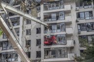 Russian missiles struck a residential building and the compound of a kindergarten in central Kyiv