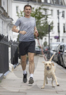 Jeremy Hunt returns home from a morning run.