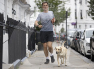 Jeremy Hunt returns home from a morning run.