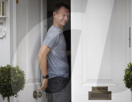 Jeremy Hunt returns home from a morning run.