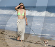 Scout Willis is seen strolling on the beach in Malibu with her musician boyfriend Jake Miller, her dog Grandma and friends on Monday afternoon. 