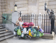 Bag lady outside Paddington station, London