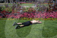 Warm weather during a heatwave as Londoners relax in Embankment Gardens, London