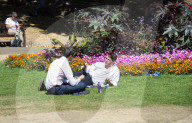 Warm weather during a heatwave as Londoners relax in Embankment Gardens, London