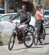 Simon Cowell, 62, and his fiancee Lauren Silverman, 45, are seen riding their bikes in Malibu with their son Eric, 8, and her son Adam Silverman, 16.