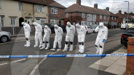 Fingertip search by forensics on the street in Knotty Ash, Liverpool