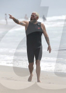 Jonah Hill packs on the PDA with his new mystery girlfriend as he enjoys Labor Day Weekend surfing on Malibu Beach.