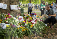 Floral tributes for HM The Queen Elizabeth II are left by mourners in Green Park London