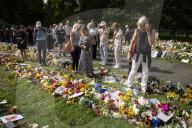 Floral tributes for HM The Queen Elizabeth II are left by mourners in Green Park London