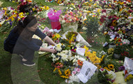 Floral tributes for HM The Queen Elizabeth II are left by mourners in Green Park London