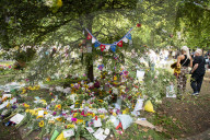 Floral tributes for HM The Queen Elizabeth II are left by mourners in Green Park London